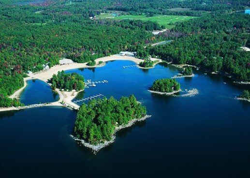 Aerial view of Point Sebago Beachfront and the tree line in the distance, Casco, Maine